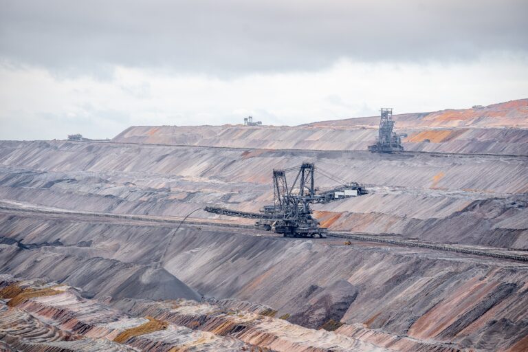 Aerial view of bucket-wheel excavators in an expansive open-pit coal mine.